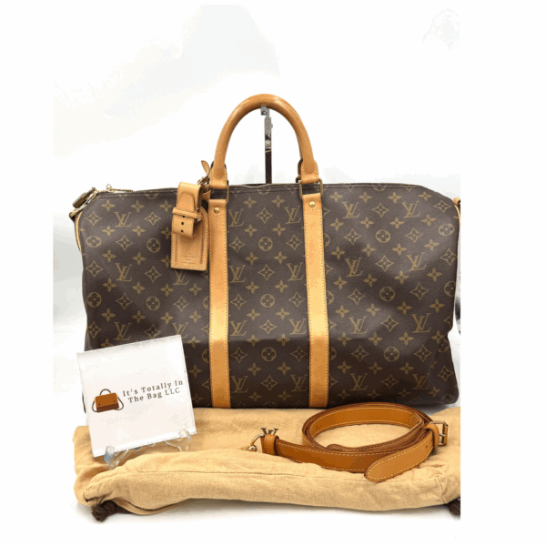 Authentic Louis Vuitton Keepall Bandouliere 50 with LV dustbag, LV tag, LV strap, and LV lock (attached with no key-on zipper pull like a charm)