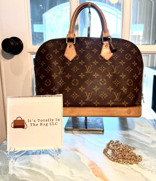 Authentic Louis Vuitton Alma PM with LV lock attached (no key) and generic crossbody chain included