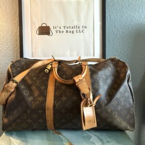 Authentic Louis Vuitton Keepall 50 Bandouliere with lock and key, LV strap, and LV luggage tag all included
