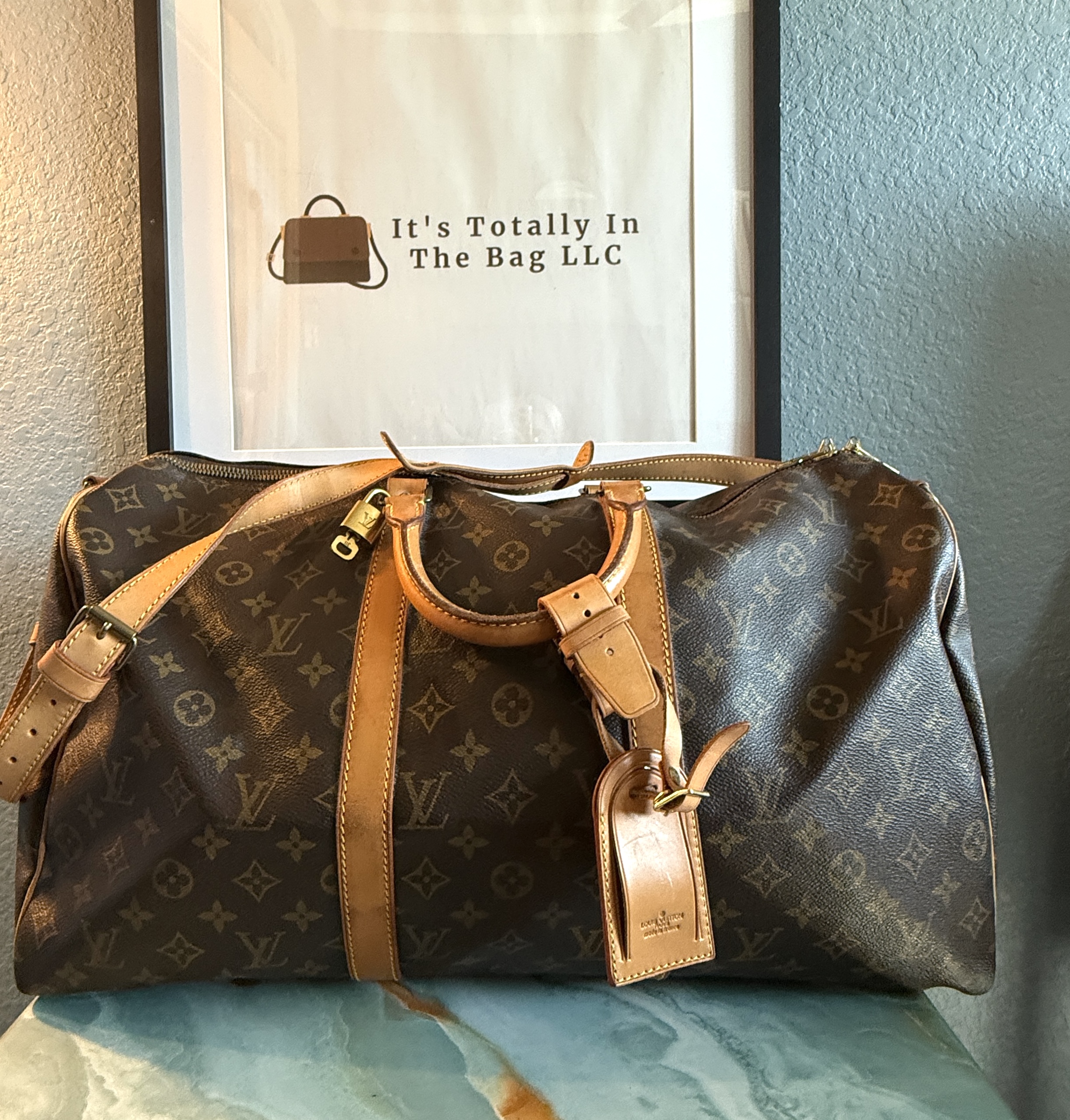 Authentic Louis Vuitton Keepall 50 Bandouliere with lock and key, LV strap, and LV luggage tag all included